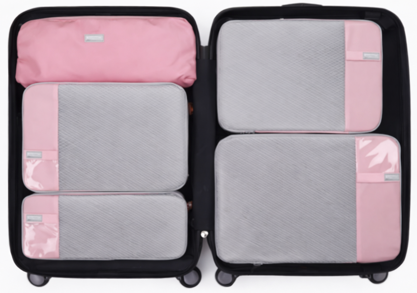 Sac de compression voyage rose avec fermeture zippée et compartiment en filet respirant pour optimiser l’espace dans la valise.