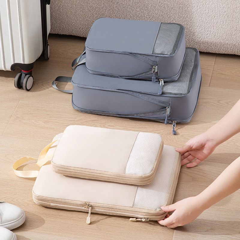 Organisateur valise élégant et robuste 3pcs, sacs de compression voyage en gris et beige, style moderne, organisation efficace pour tous types de bagages.