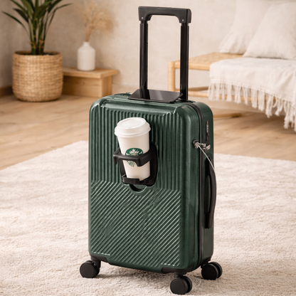 Petite valise trolley Zen cabine verte dans un salon moderne, gobelet de café ouvert