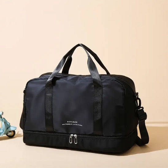 grand sacvoyage noir sur comptoir petite roue mobylette