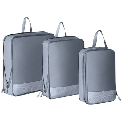 Organisateur valise élégant et robuste 3pcs gris, sacs de compression voyage sur fond blanc, visibilité claire des tailles pour un rangement structuré.