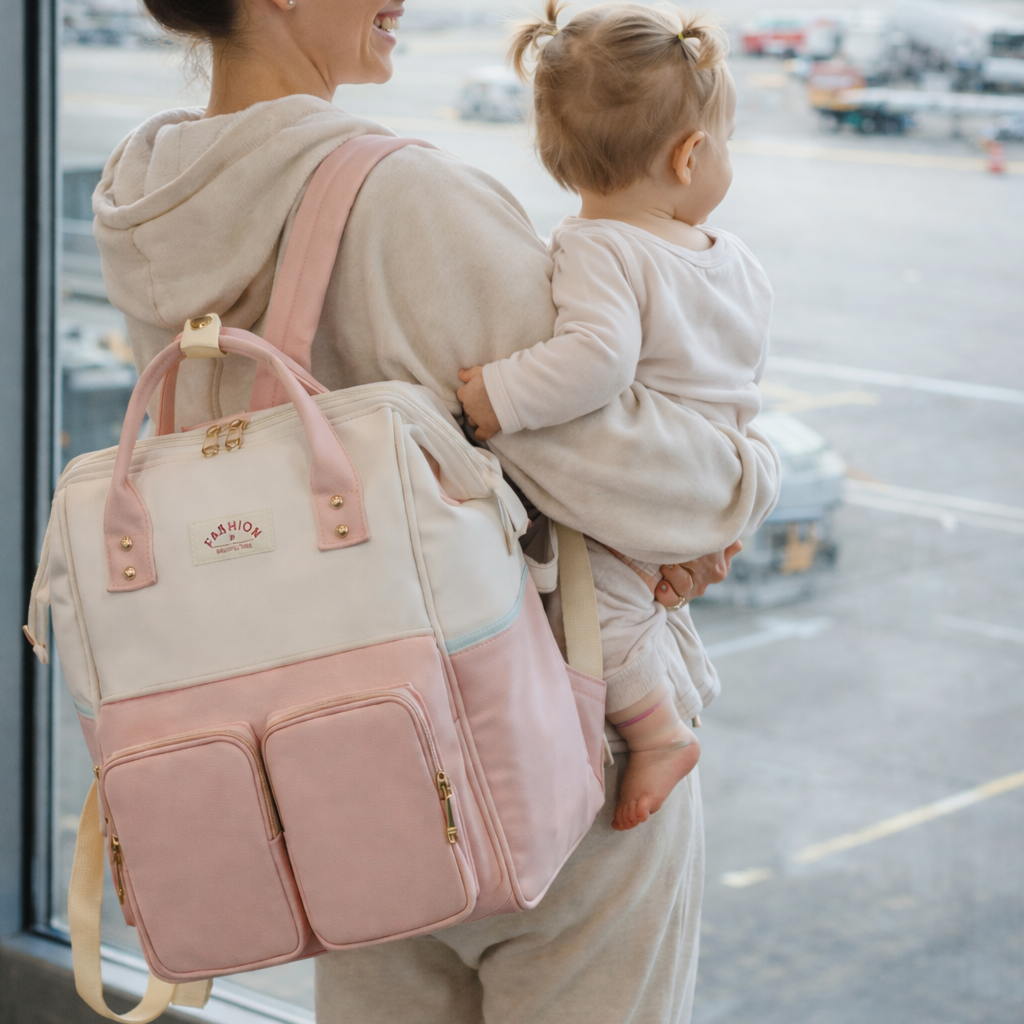 Sac de voyage à dos pour bébé rose et blanc – multipoches, pratique pour l’avion et les sorties en famille