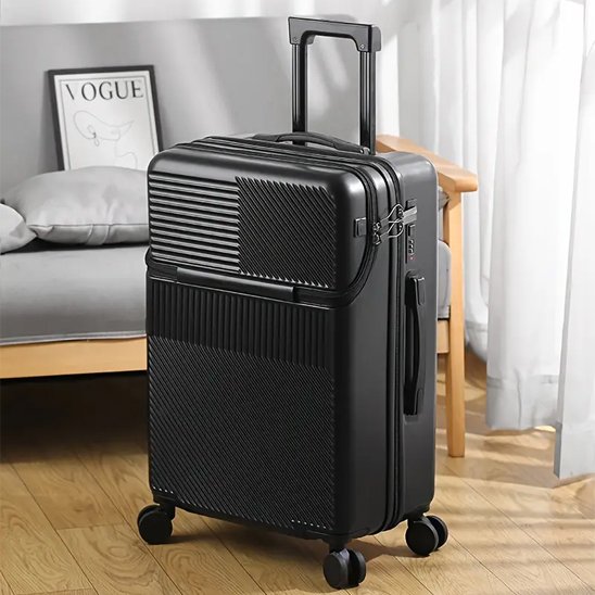 Valise rigide 24 pouces noire dans un salon, compartiment frontal fermé